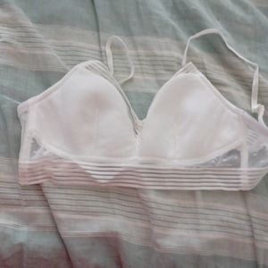 Wireless white poke dot lace in large bra.